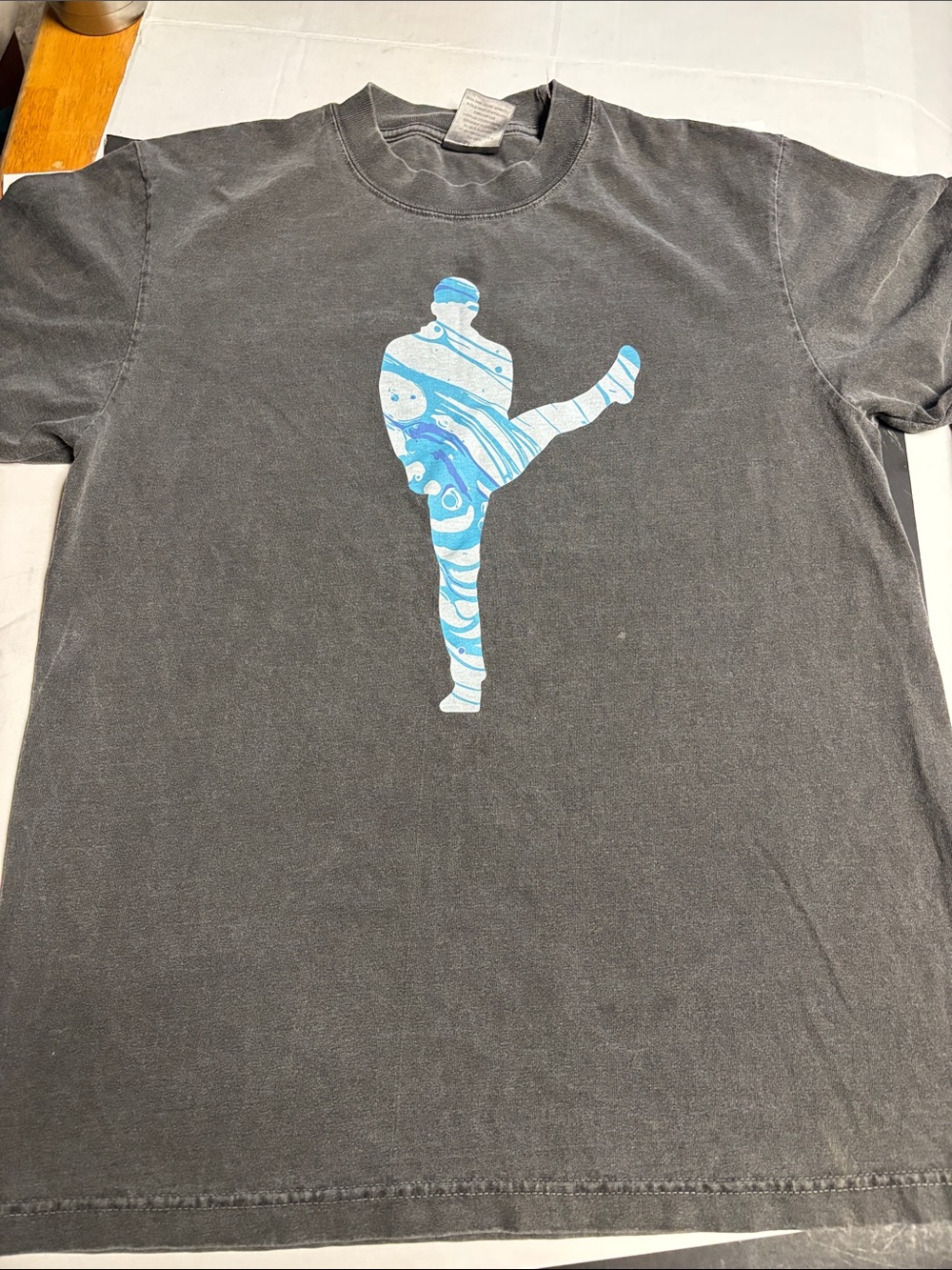 Shaka Wear Men's Black Short-Sleeve Graphic Tee with Blue Marble Silhouette